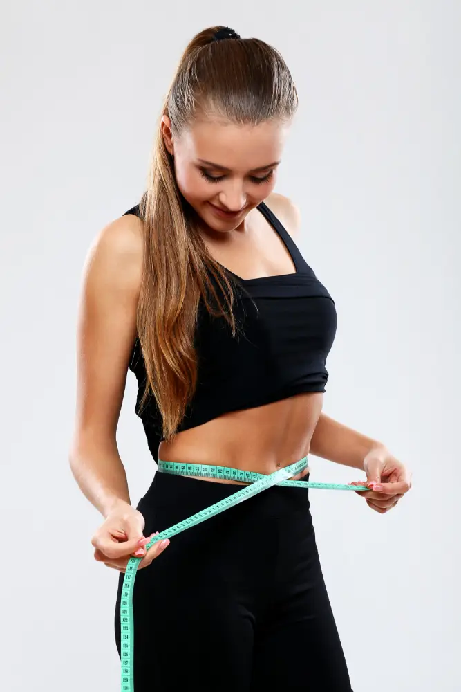 fitness-girl-measuring-her-waist